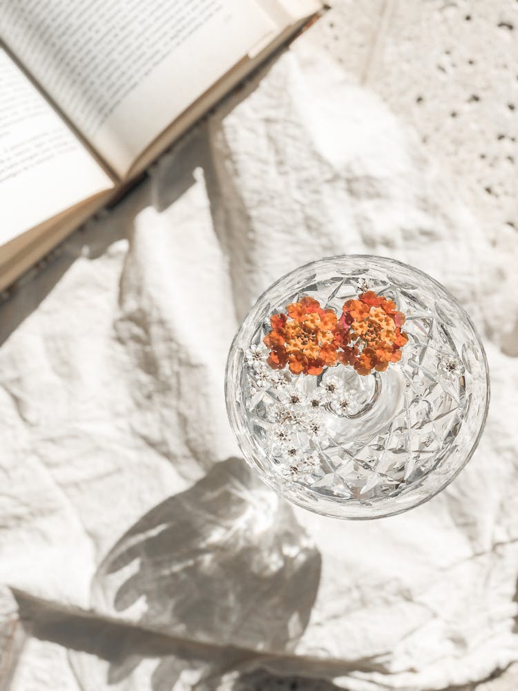 Crystal Vase With Flowers By Book