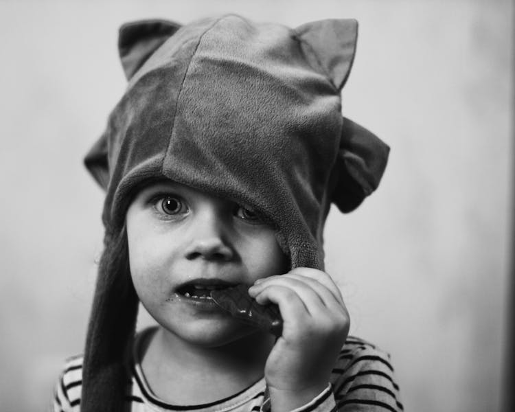 Child Eating A Candy