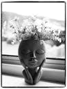 Black and White Flower Vase with a Face