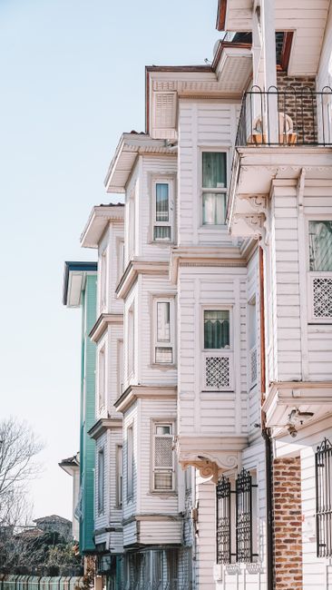 Charming wooden houses with classic architectural details on a sunny day in Istanbul, Turkey.