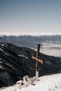 Brown Wooden Cross on Top of Mountain