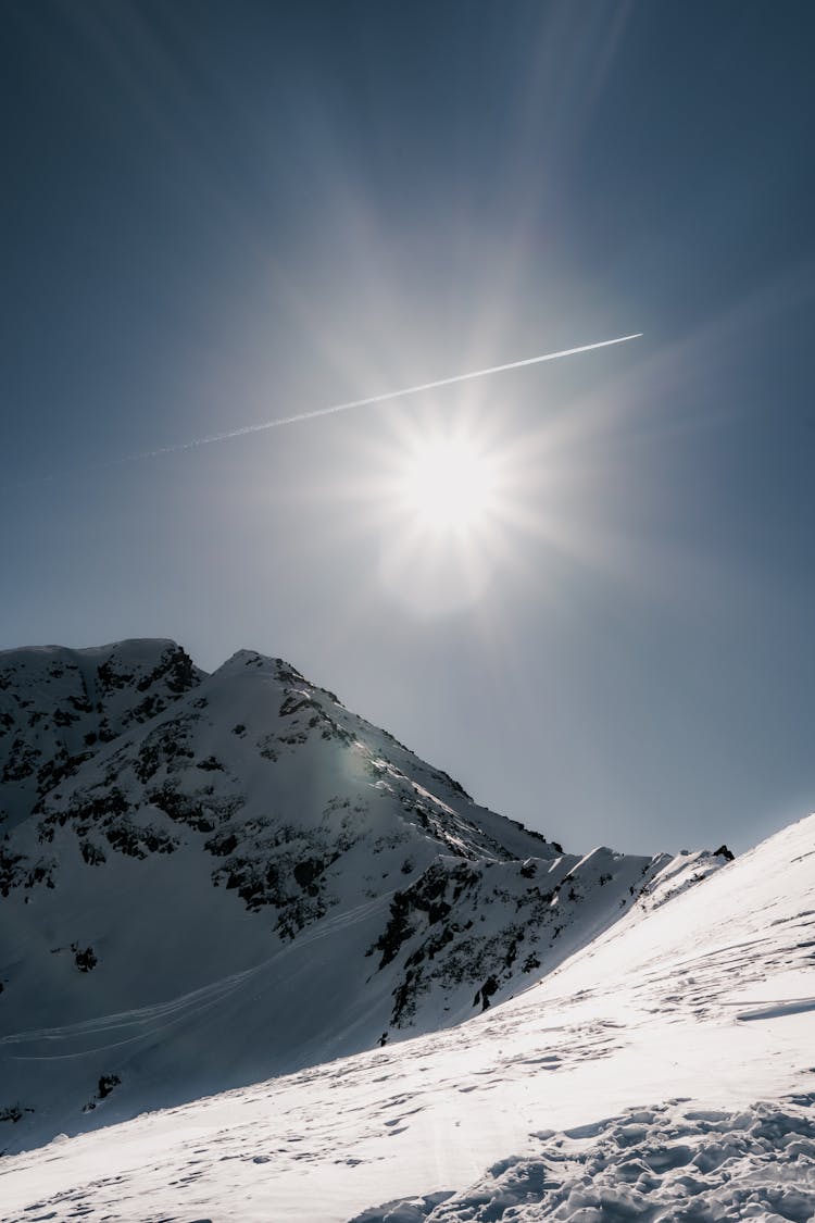 Sun Above Mountains In Snow