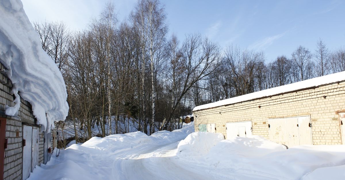 Snow-covered four-season cottage on a plowed road in Ontario, showing why winter use changes every carrying cost