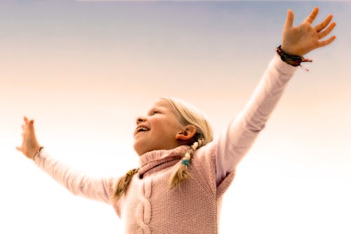 Blonde Haired Girl Wearing Pink Sweater