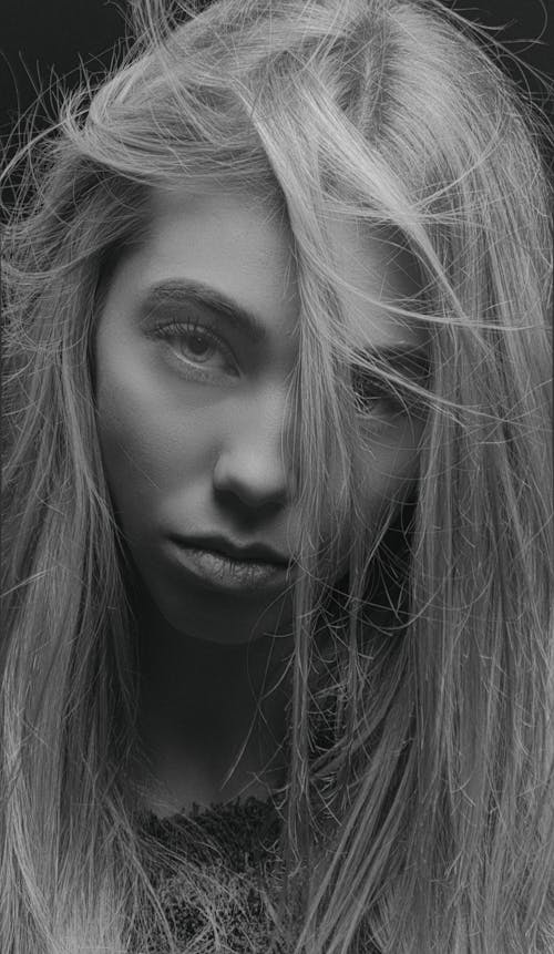 Close Up Photo of a Woman in Black and White Photography