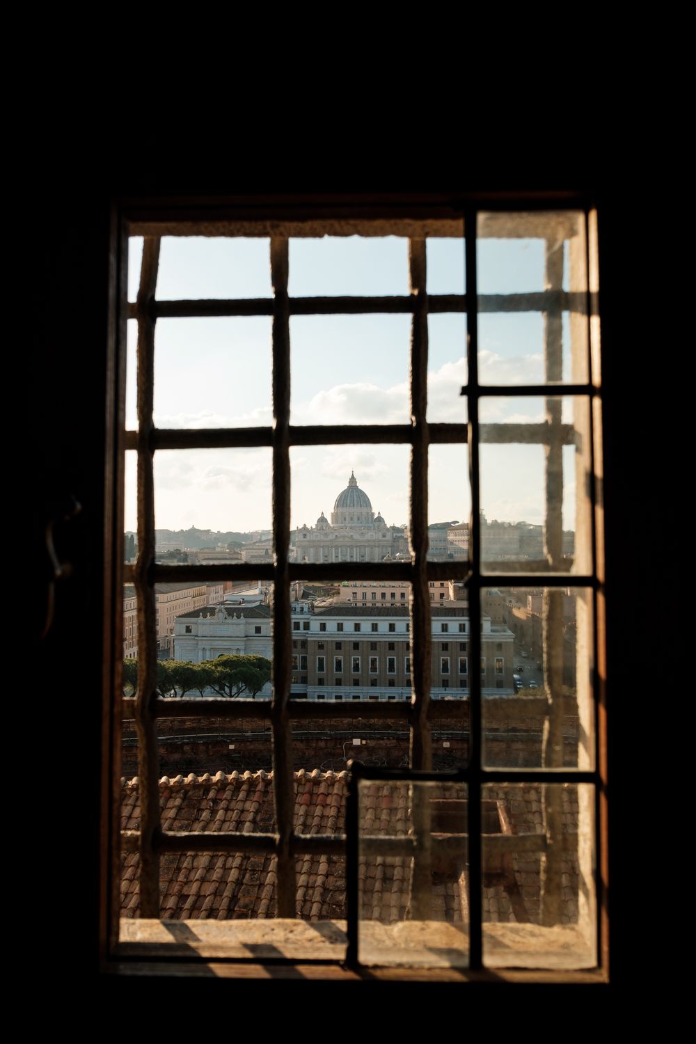 Roofs of Buildings behind Window with Bars · Free Stock Photo