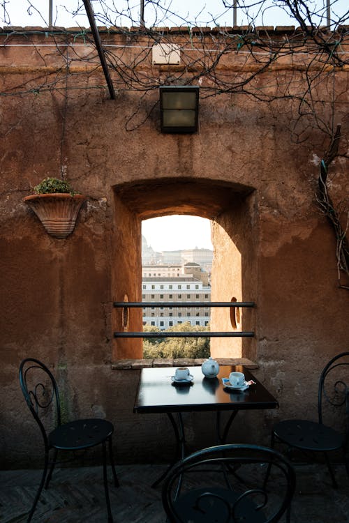 A Table beside a Window at a Coffee Shop in Rome