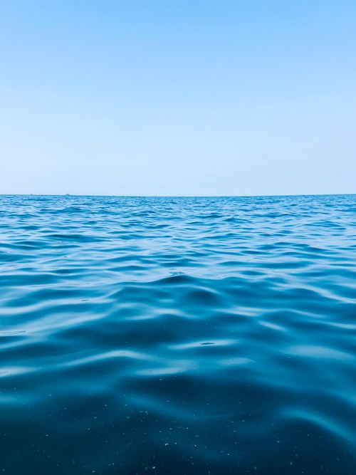 Free A serene view of the blue ocean with a clear sky, captured near Karachi, Pakistan. Stock Photo