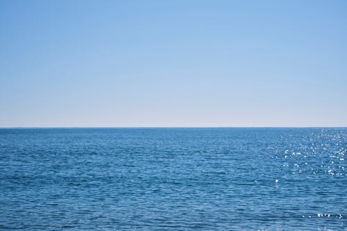 A Body of Water Under the Blue Sky