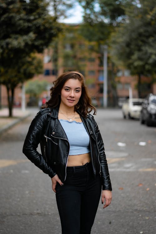 Smiling Woman Posing in Leather Jacket
