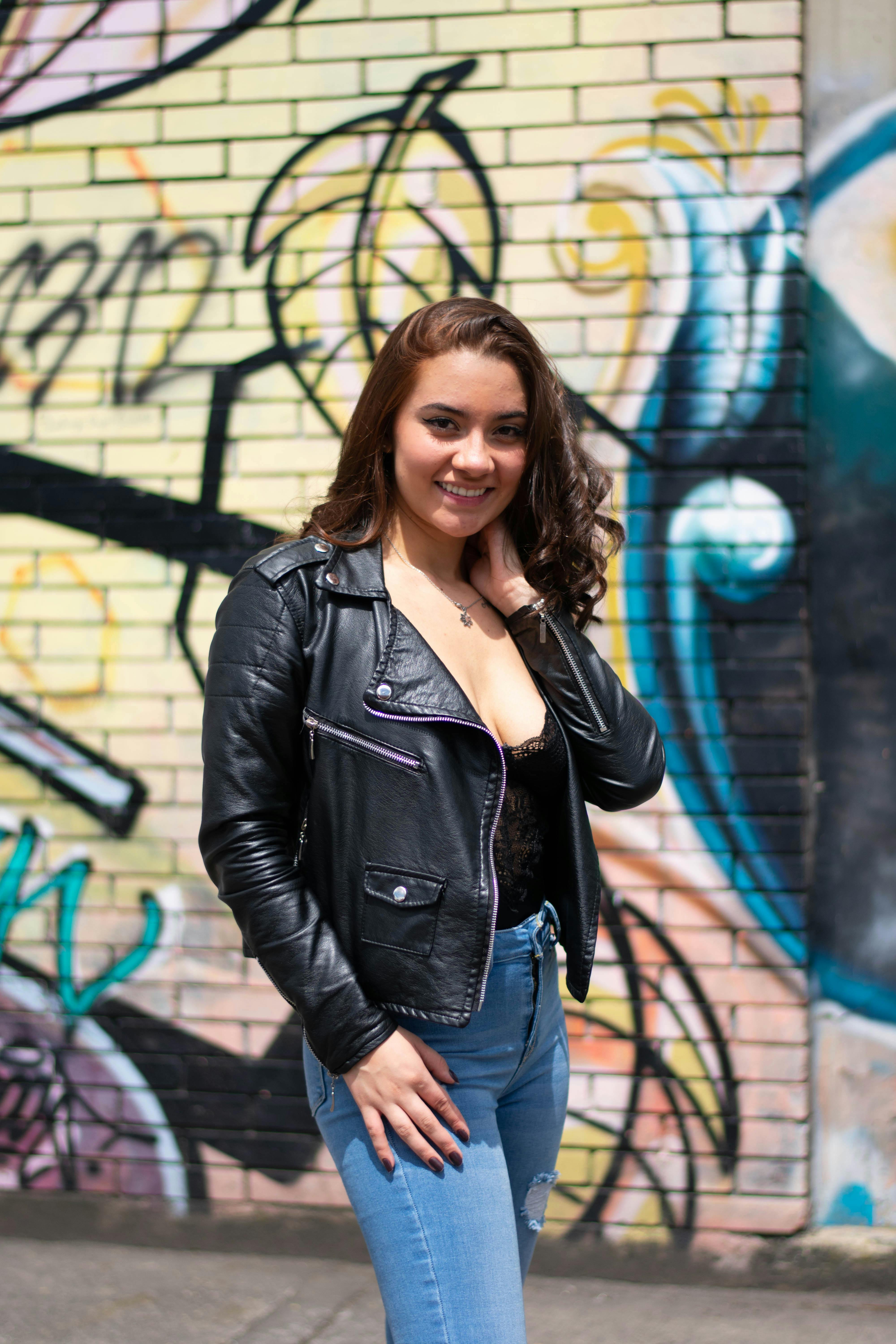 Royalty-Free photo: Woman wearing black and brown bra and blue denim short