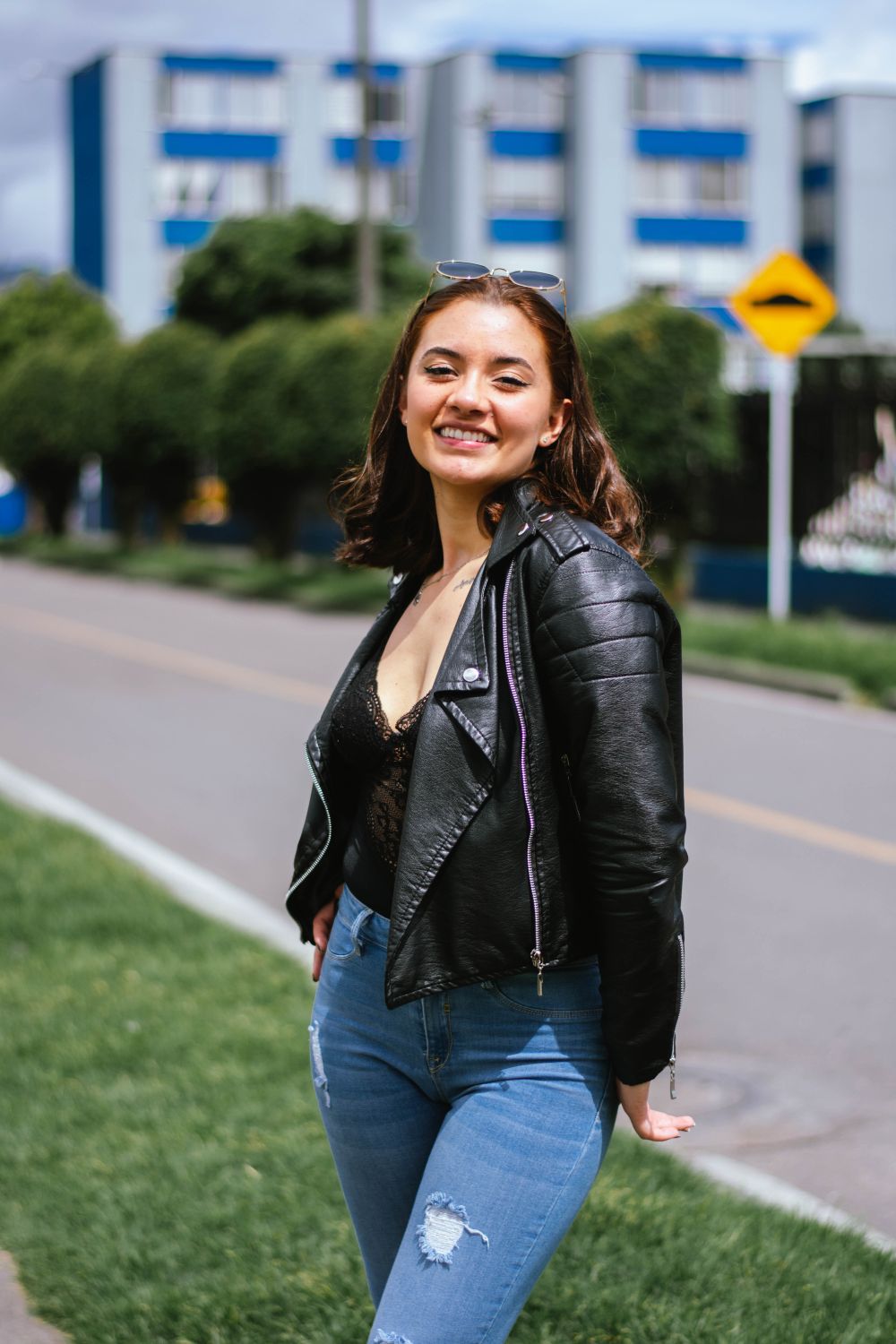 Woman in Black Leather Jacket Standing on the Side of the Road · Free ...
