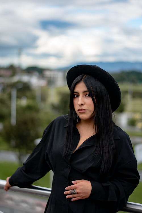 Brunette in Black Dress and Hat