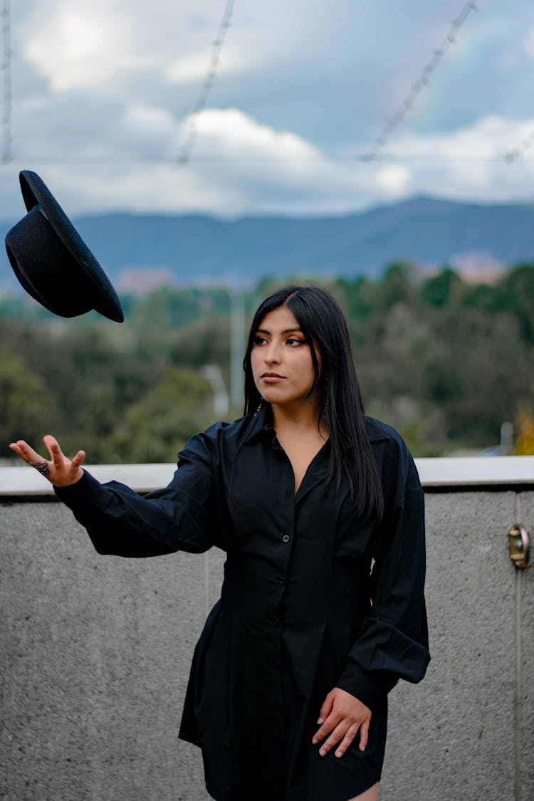 Photo Of A Woman Tossing Her Hat