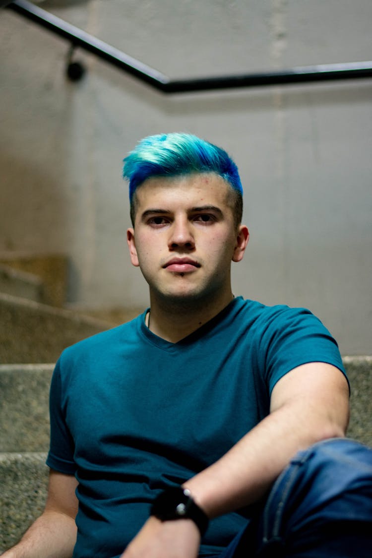 Man With Blue Hair Sitting On Stairs