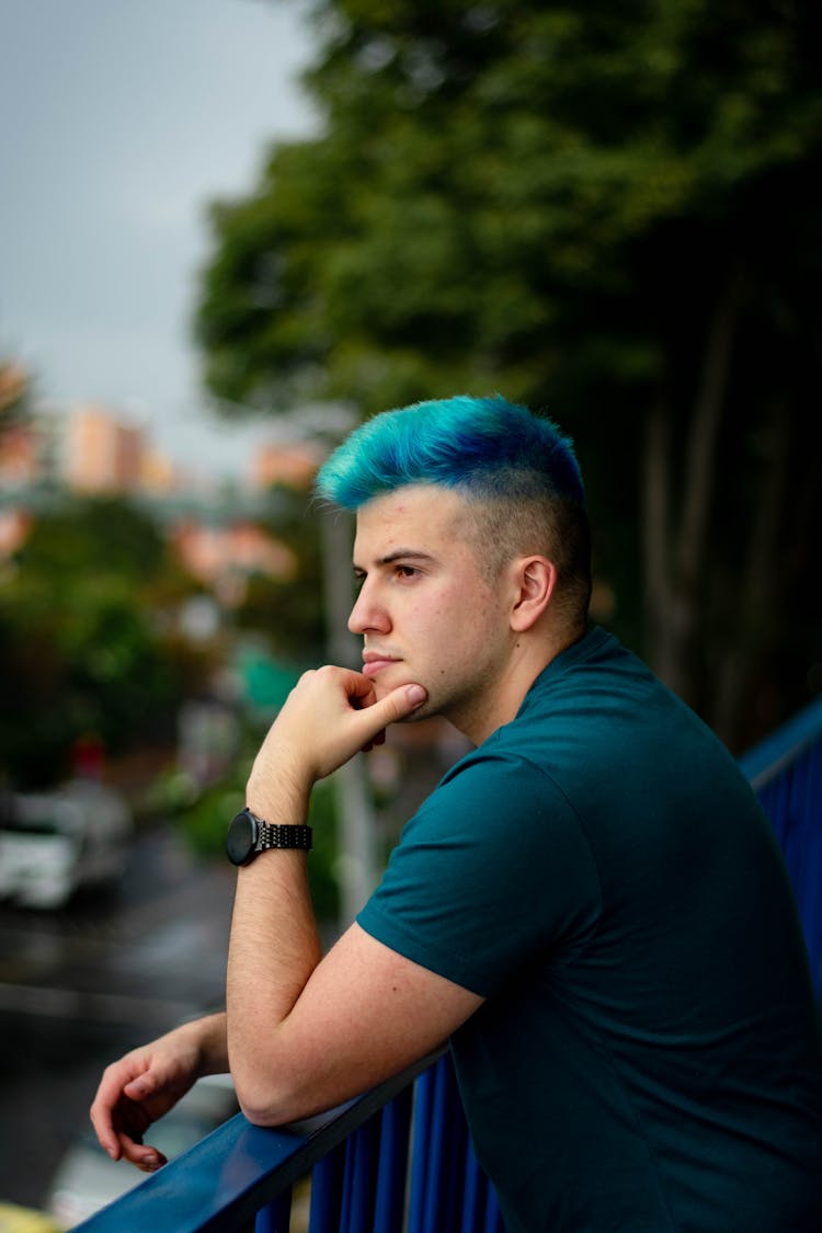 Side View Of Man In Blue Shirt And Hair 