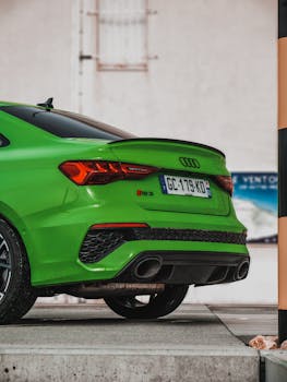 Close-up of a green Audi RS3 parked on Mont Ventoux, highlighting luxury details.