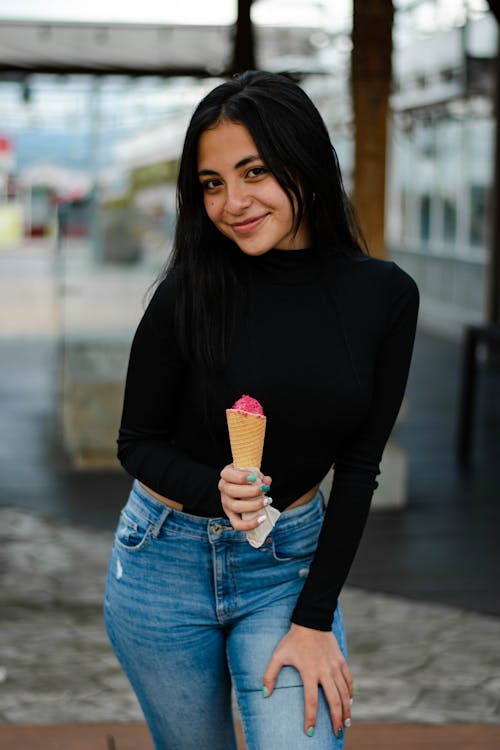 Smiling Girl Holding an Ice Cream Cone 