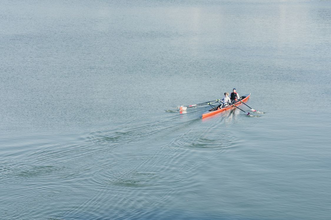 People Riding a Boat in the Sea · Free Stock Photo