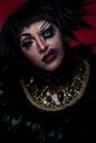 Woman in Black and Gold Crown