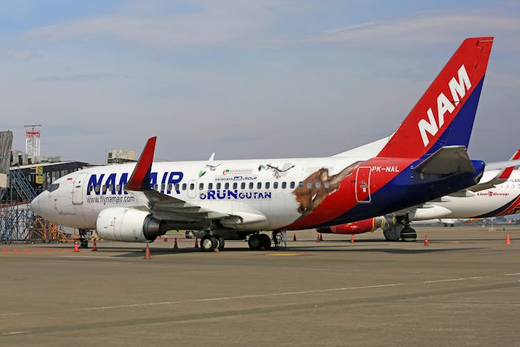 Airplanes Parked On A Runway