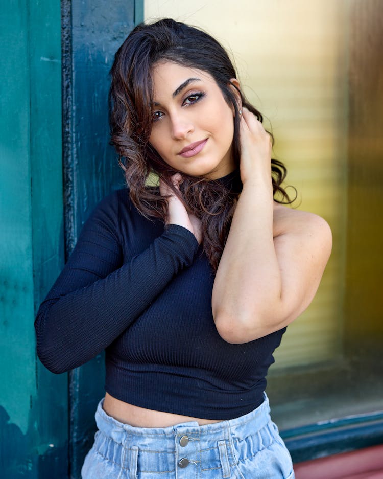 Portrait Of Woman In Asymmetrical Black Top