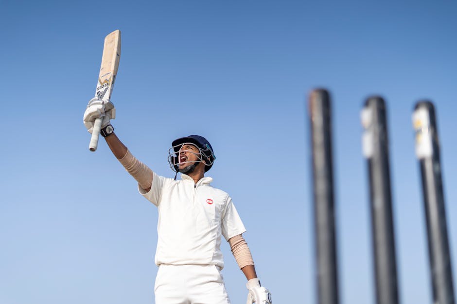A Man Shouting for Victory while Holding His Cricket Bat