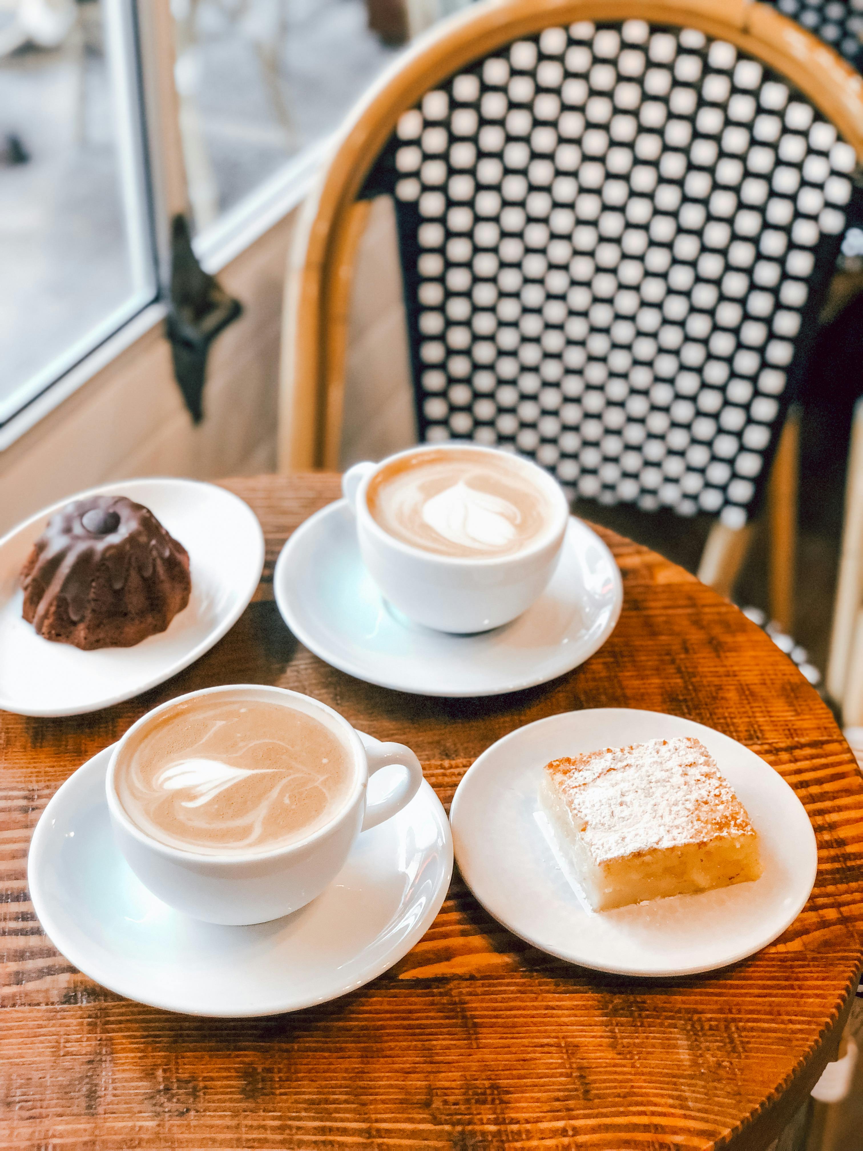 Cup of Coffee and Pastry on Round Table