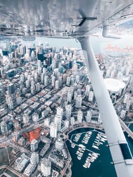 Stunning aerial perspective of downtown Vancouver's skyline and harbor.