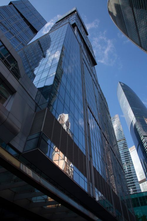 Free Tall skyscrapers reflecting blue sky, showcasing modern architecture in Moscow's business district. Stock Photo