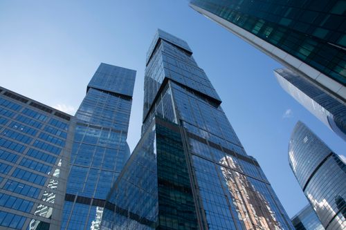 Free Dynamic view of Moscow's striking modern skyscrapers under a clear blue sky. Stock Photo