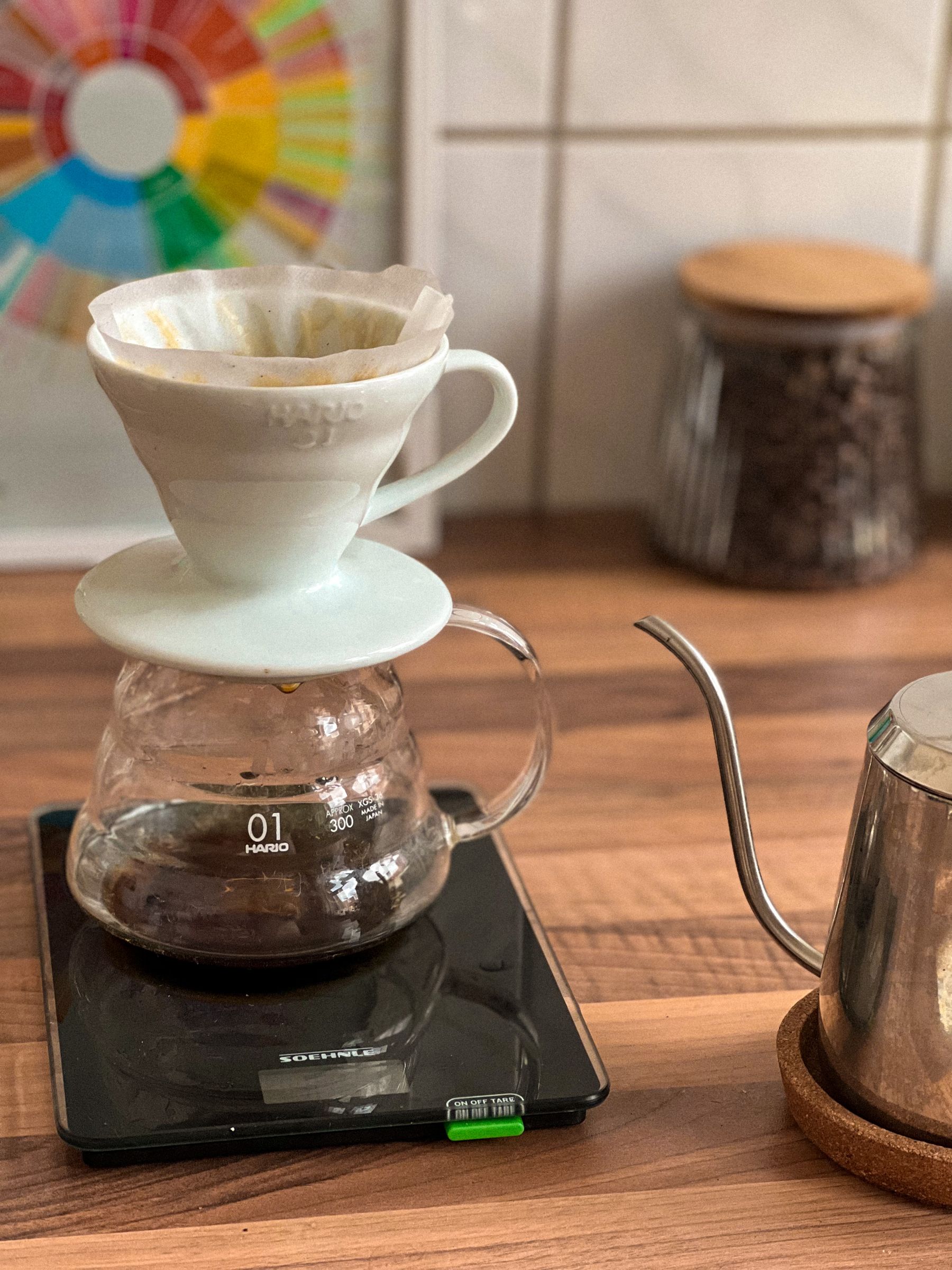 Calm kitchen beverage setup with kettle and pour-over equipment