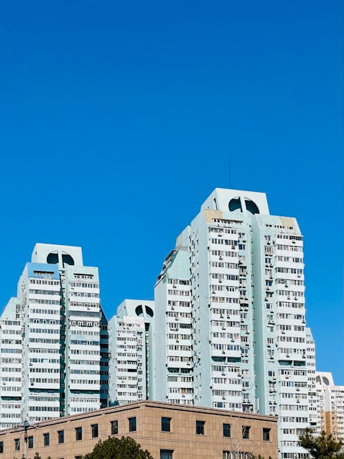 Two White Concrete Buildings in the City