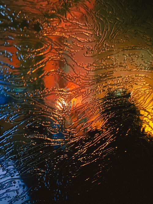 Free Close-up of colorful water texture with dynamic lighting effects. Stock Photo