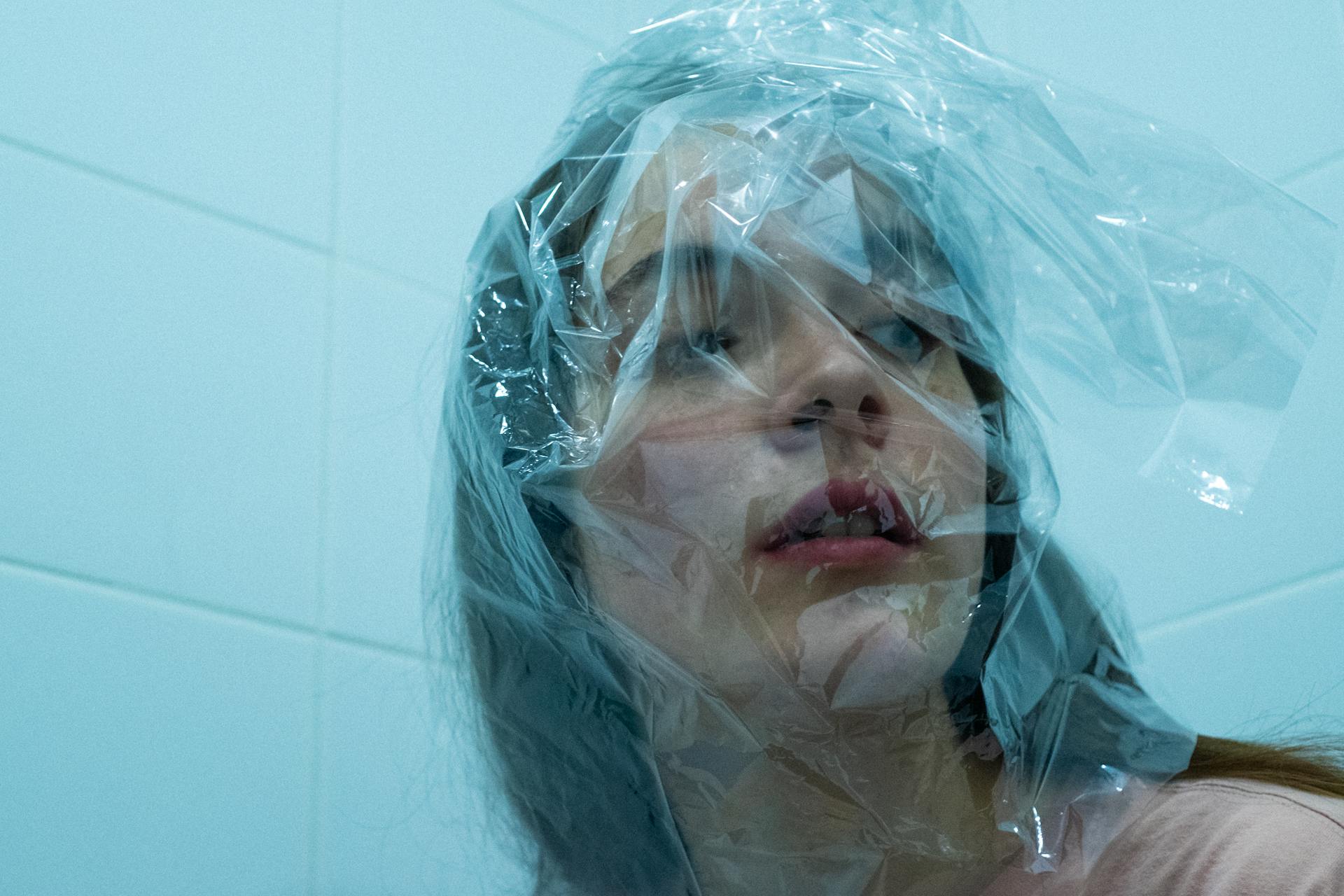 Woman Covered With Clear Plastic on Head