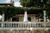 A White Dress Hanging on the Trellis