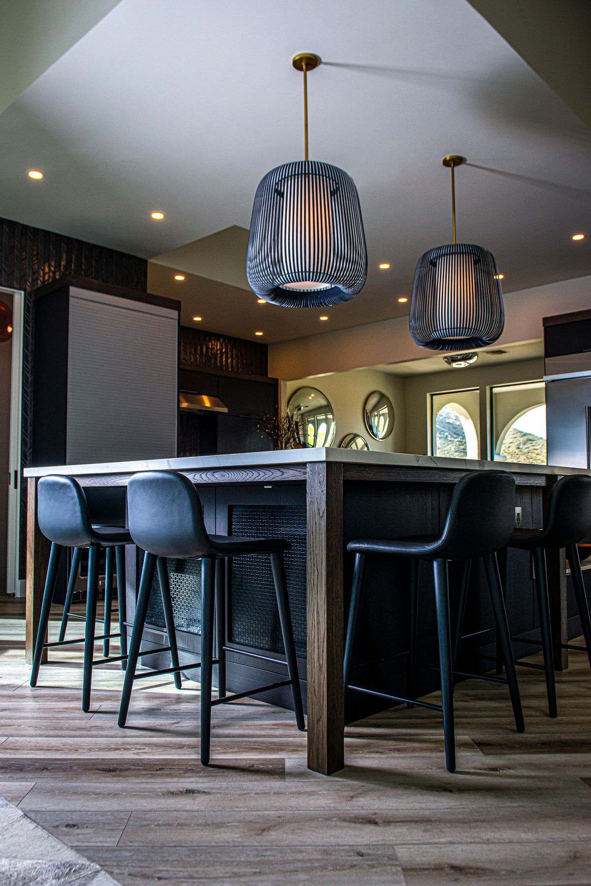 Modern pendant lamps installed above a kitchen island
