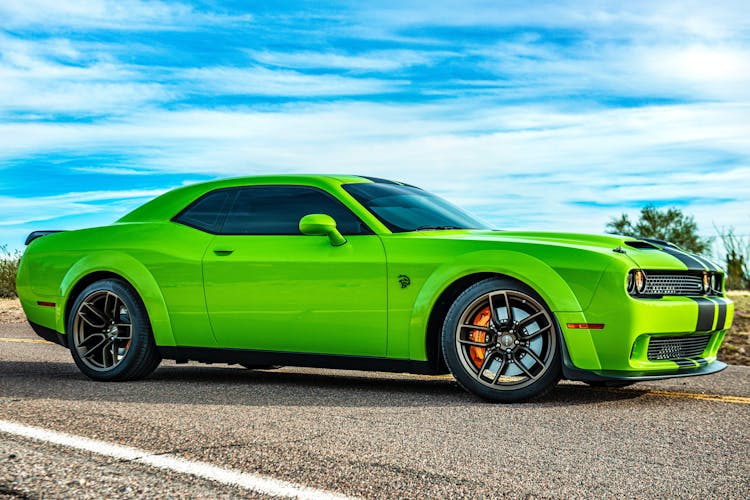 Green Luxurious Car On Road