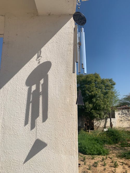 Wind chime hanging on wall
