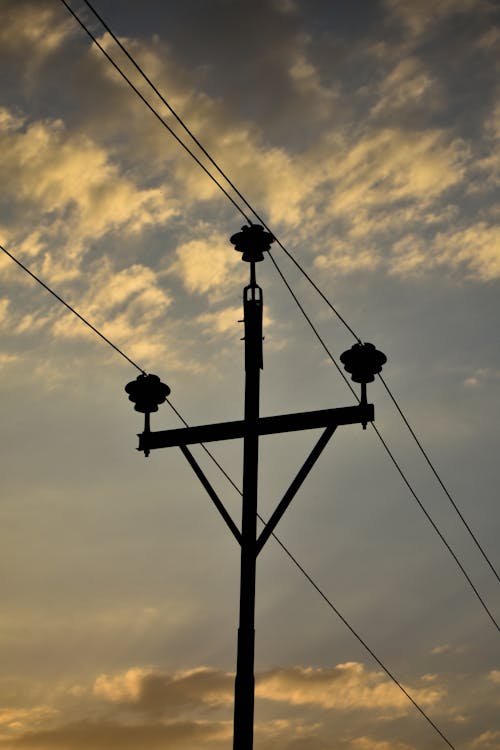 Electricity Pole Silhouetted against the Sky at Dusk
