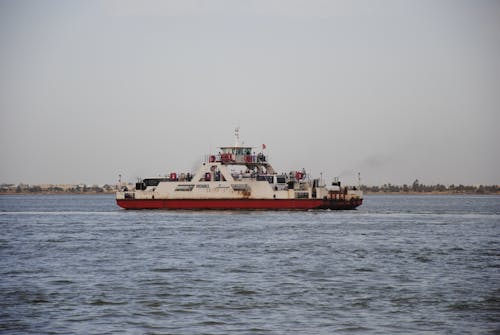 Red and White Ferry Boat on Sea