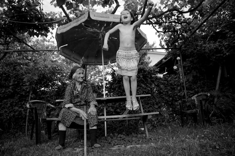 A Grandmother With Her Granddaughter Playing