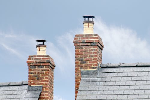 Brick Chimney with Smoke Coming Out