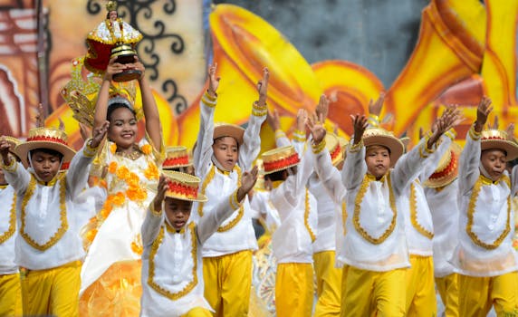 Children in traditional costumes dance at Sinulog Festival, Cebu City.