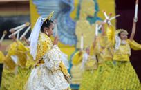 Colorful Sinulog festival dancers in traditional attire performing in Cebu City, Philippines.