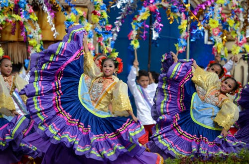 Girls in Traditional Dress Dancing During a Sinulog Festival