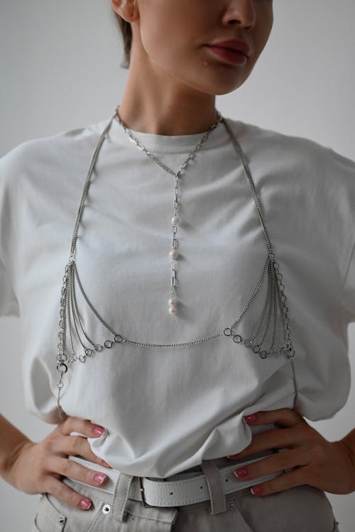 Free Woman in White Crew Neck Shirt Wearing Silver Necklace Stock Photo