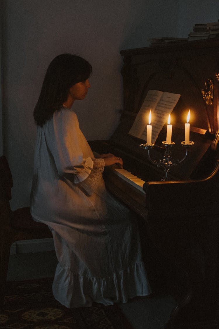 Woman In Long Nightgown Playing The Piano 