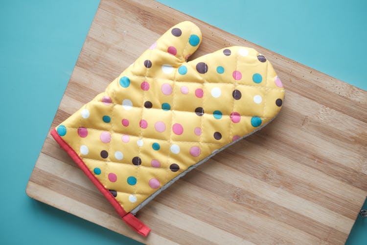 Kitchen Glove On Cutting Board