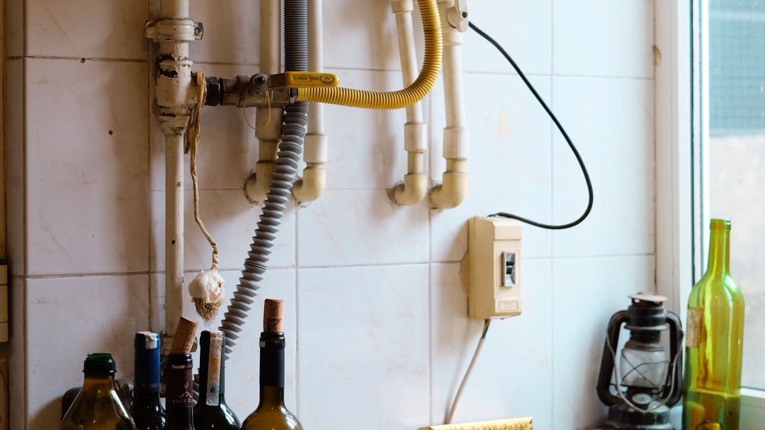 A working kitchen counter. What gets scraped into the sink here is what the drain has to carry.